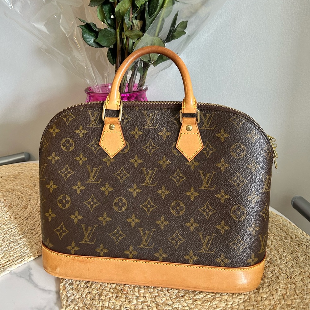 Louis Vuitton Alma Monogram Handbag